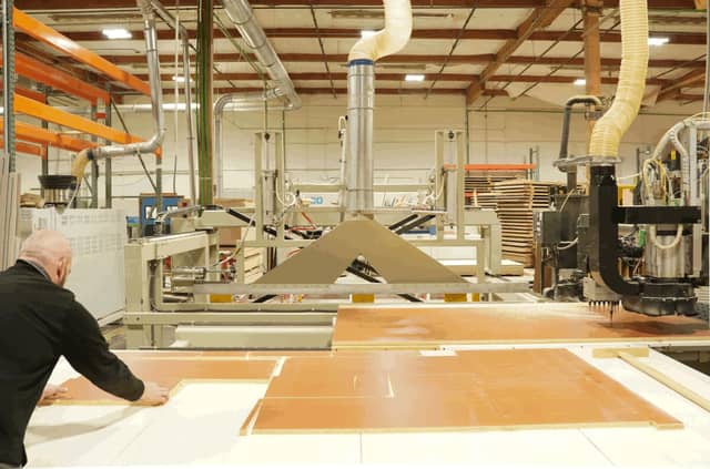 lady sitting at desk with laptop typing