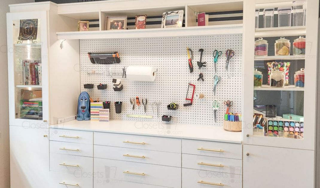 Craft room with a white craft organizer with craft material